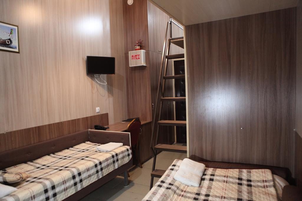 Четырехместный (Четырехместный номер с ванной комнатой) мини-отеля Ринг, Волгоград