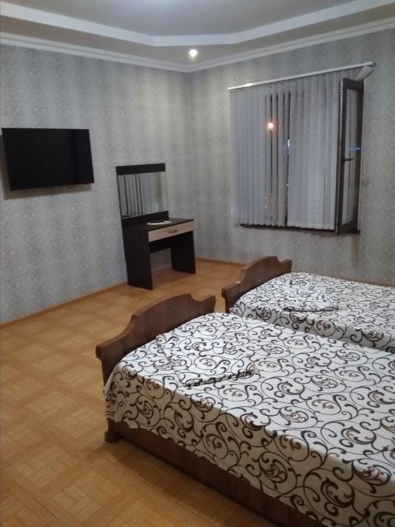 Двухместный (Двухместный номер с 2 отдельными кроватями) мини-отеля Посейдон, Владикавказ