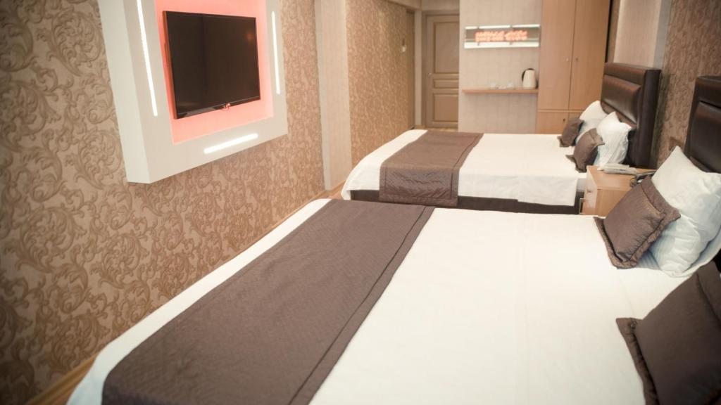 Двухместный (Двухместный номер с 1 кроватью или 2 отдельными кроватями и базовыми удобствами) отеля Yayla Hotel, Измир