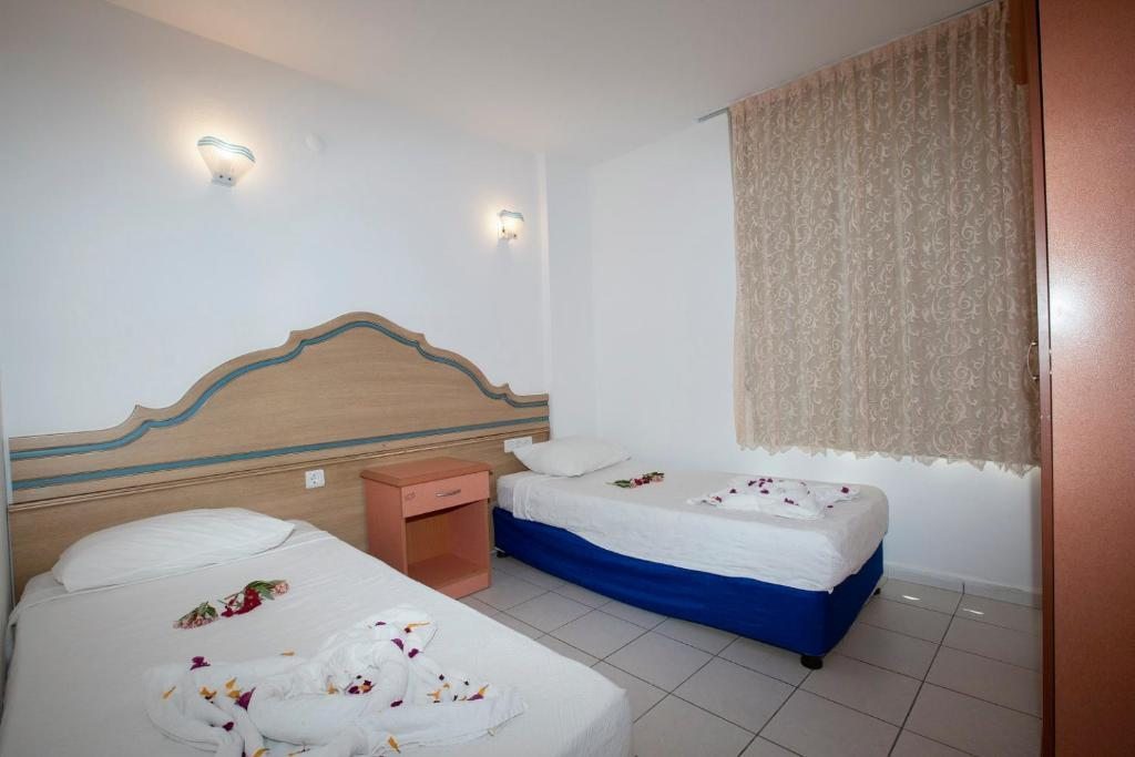Двухместный (Стандартный двухместный номер с 1 кроватью или 2 отдельными кроватями) отеля Camyuva Motel, Кемер