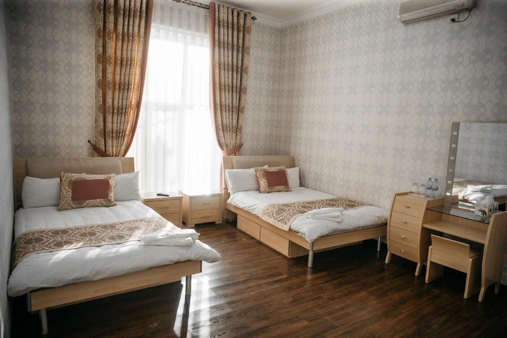 Двухместный (Улучшенный двухместный номер с 2 отдельными кроватями) отеля Shahlo, Самарканд