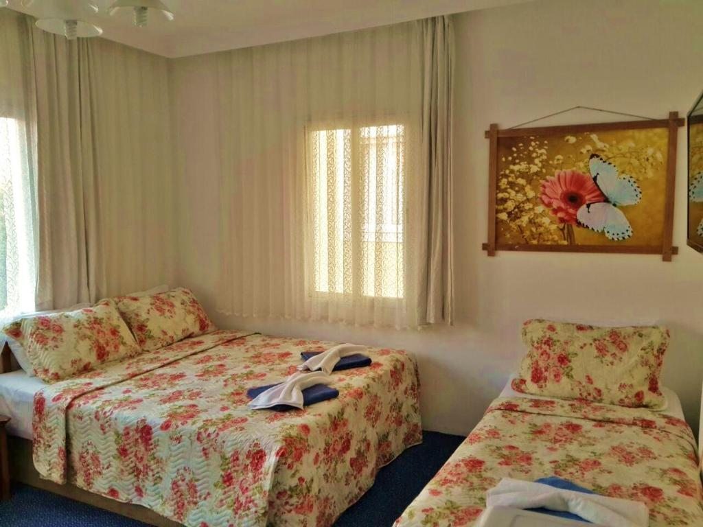 Двухместный (Стандартный двухместный номер с 1 кроватью или 2 отдельными кроватями) отеля Adil Pansiyon, Чешме
