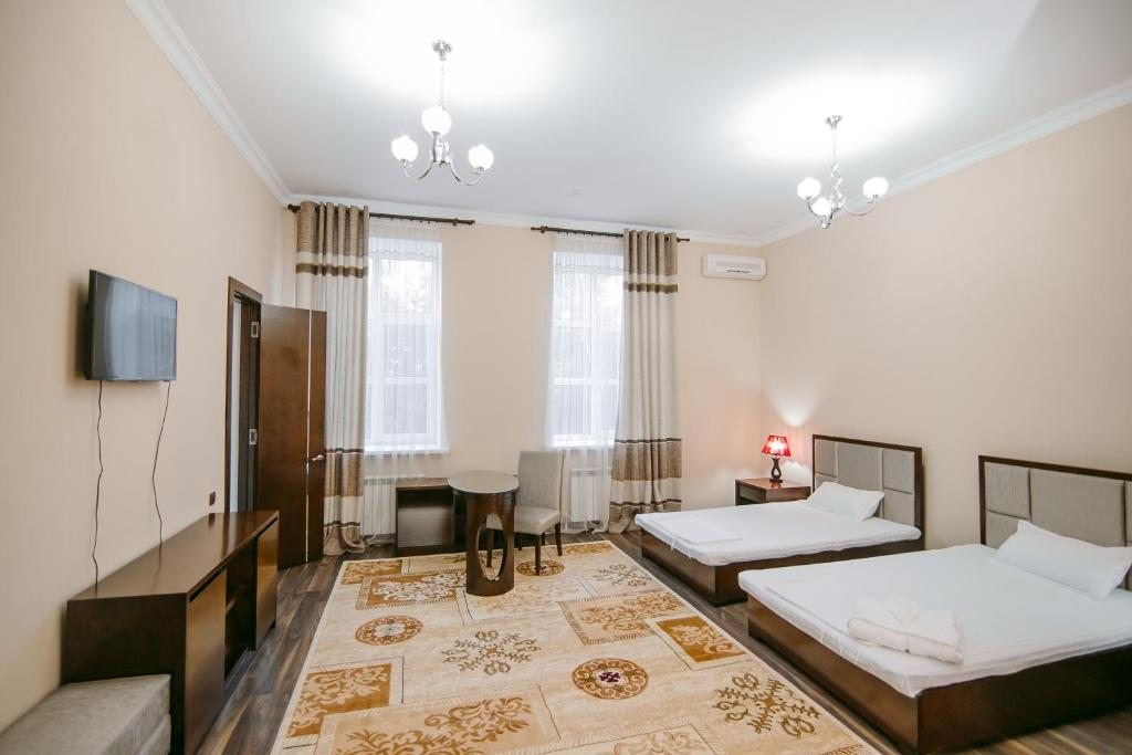 Двухместный (Стандартный двухместный номер с 2 отдельными кроватями) отеля Инжу, Тараз