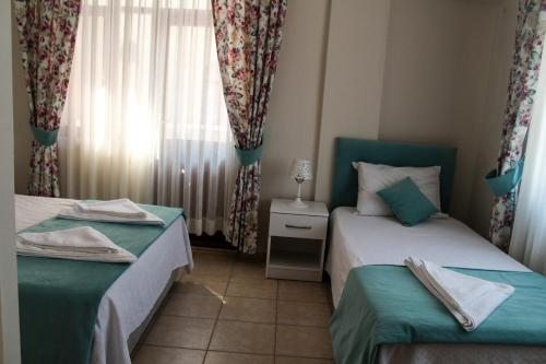 Двухместный (Стандартный двухместный номер с 1 кроватью или 2 отдельными кроватями (2+1)) отеля Dalyan Terrace Hotel, Дальян