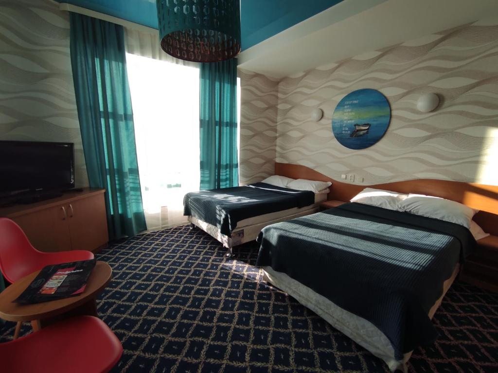 Двухместный (Двухместный номер с 2 отдельными кроватями и видом на море) отеля Три Дельфина, Актау