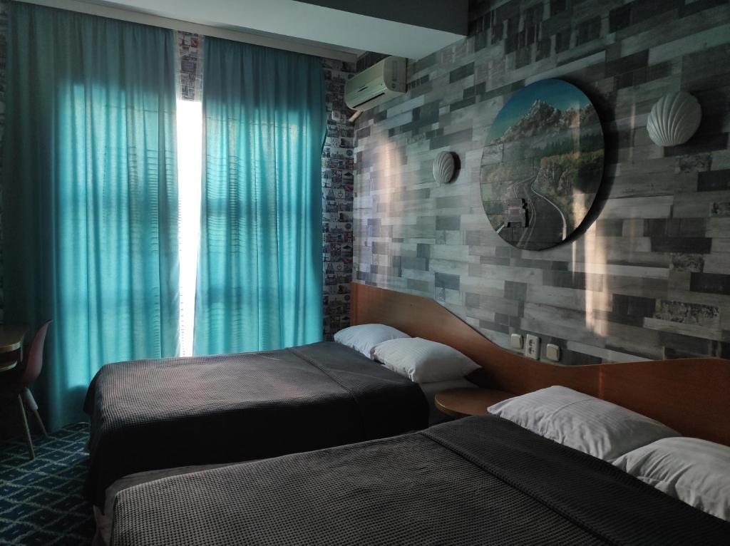 Двухместный (Двухместный номер с 2 отдельными кроватями) отеля Три Дельфина, Актау