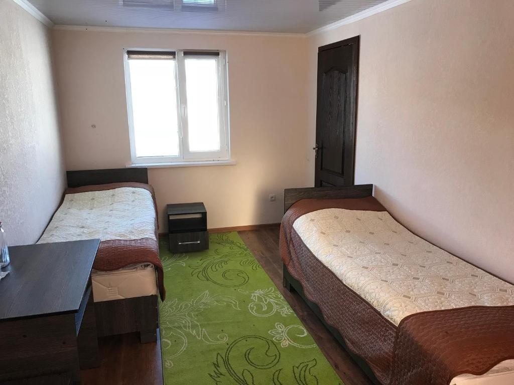 Двухместный (Двухместный номер с 2 отдельными кроватями и собственной ванной комнатой) гостевого дома Alakol-Jyrgalan, Джергалан