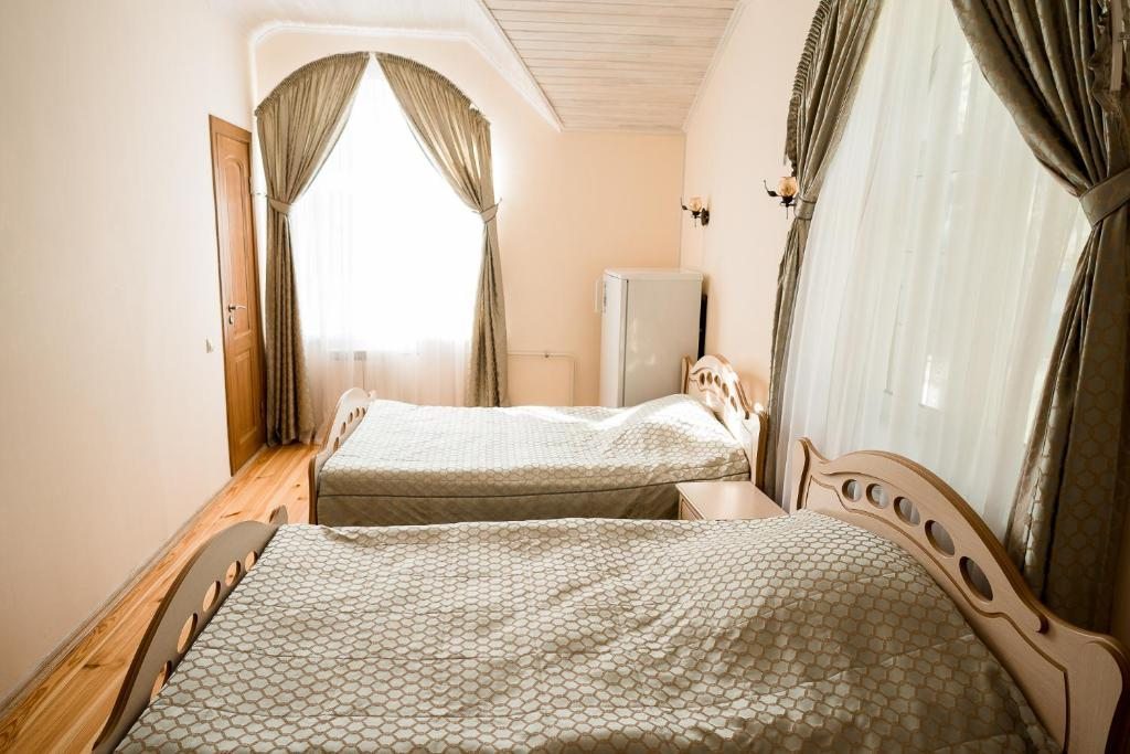 Двухместный (Просторный двухместный номер с 2 отдельными кроватями) отеля Беловежская Пуща Жарковщина