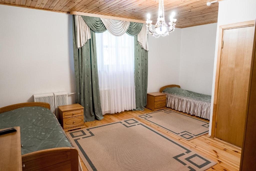 Двухместный (Небольшой двухместный номер с 2 отдельными кроватями) отеля Беловежская Пуща Жарковщина