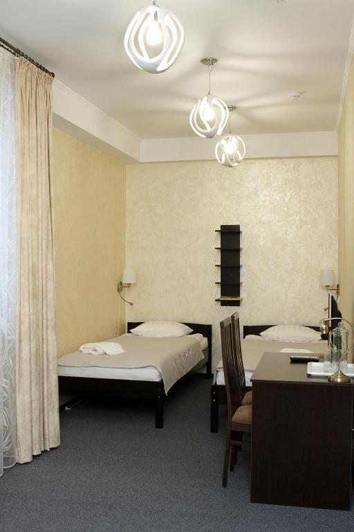Двухместный (Улучшенный двухместный номер с 2 отдельными кроватями) отеля Акватель, Брест