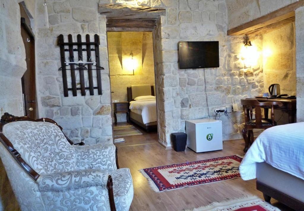 Трехместный (Трехместный суперлюкс) отеля Cave Konak Cappadocia- Special Category, Ургюп
