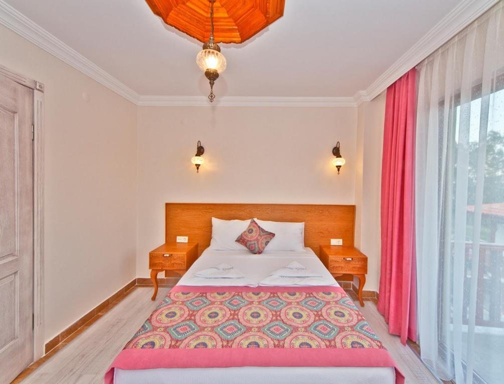 Двухместный (Двухместный номер Делюкс с 1 кроватью или 2 отдельными кроватями, вид на горы) апарт-отеля Gumus Konak, Акьяка