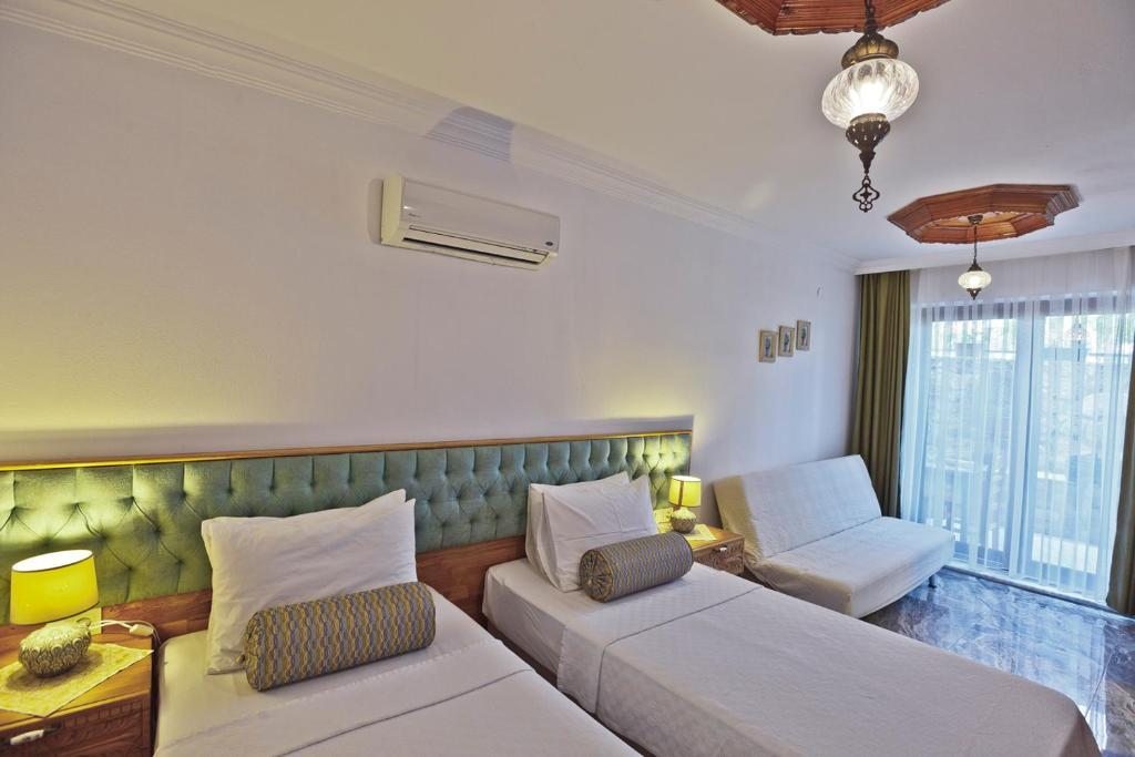 Двухместный (Стандартный двухместный номер с 1 кроватью или 2 отдельными кроватями) апарт-отеля Gumus Konak, Акьяка
