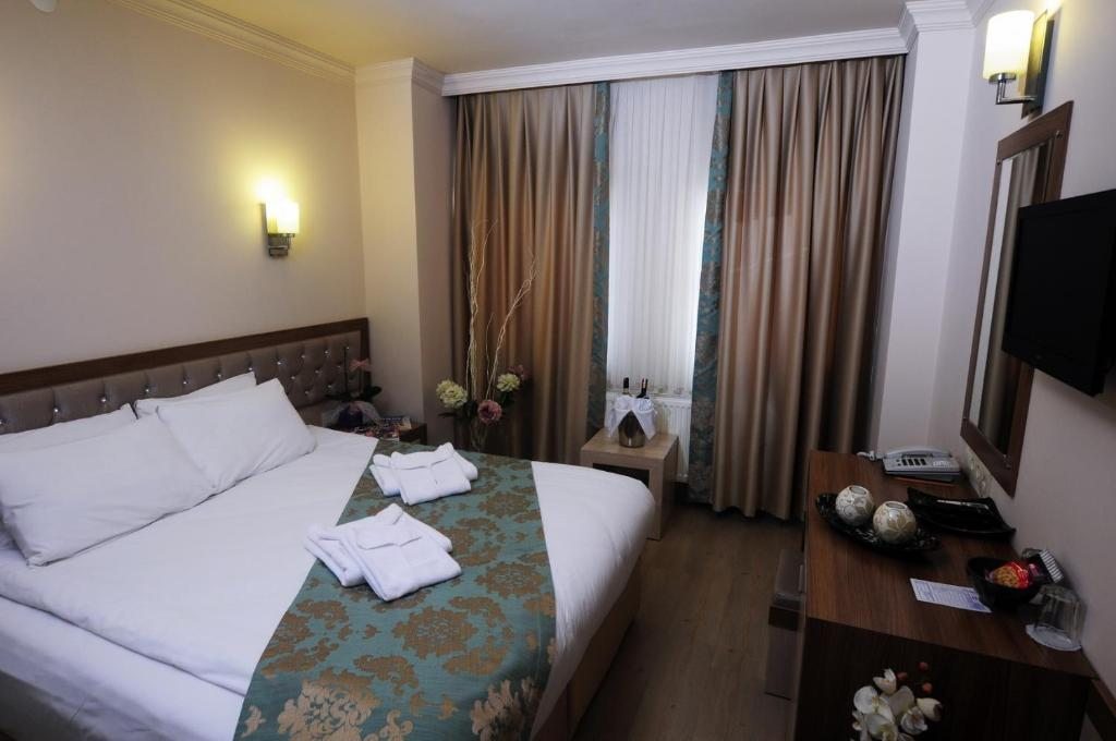 Двухместный (Двухместный номер с 1 кроватью или 2 отдельными кроватями) отеля Hotel Helen Park, Чанаккале