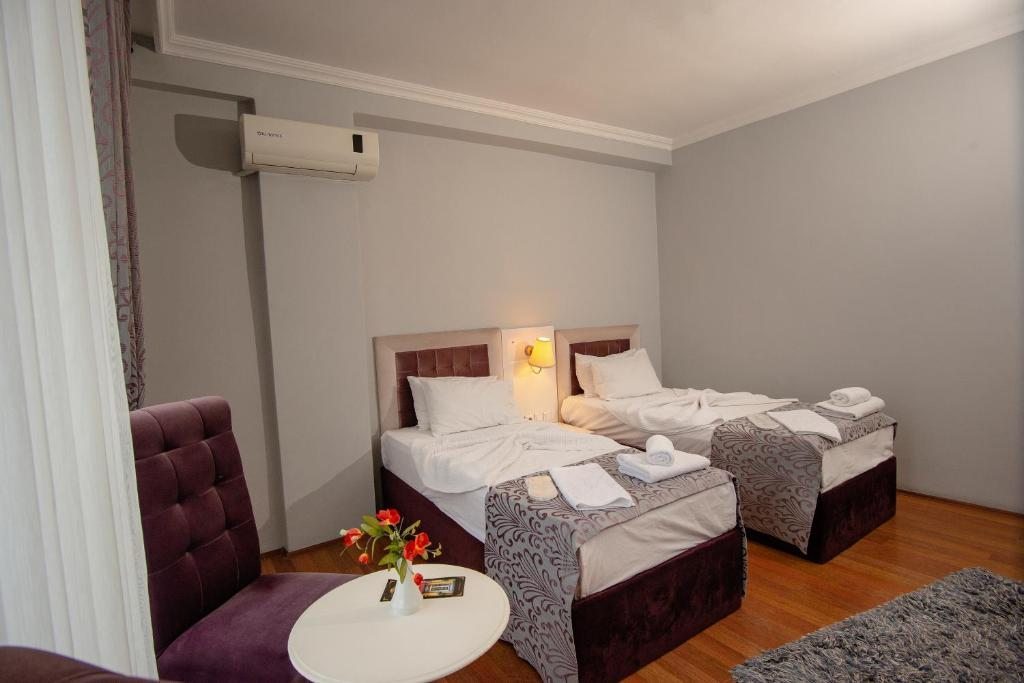 Двухместный (Улучшенный двухместный номер с 2 отдельными кроватями) отеля SRF Hotel, Эскишехир