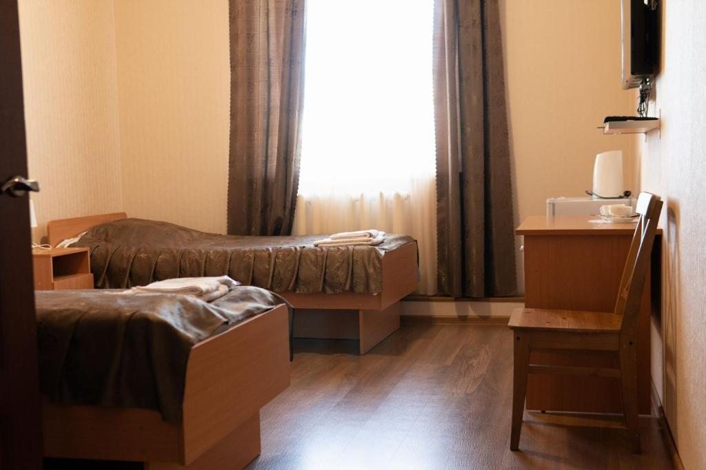 Двухместный (Стандартный двухместный номер с 2 отдельными кроватями) отеля Усадьба на Сушзаводской, Лотошино