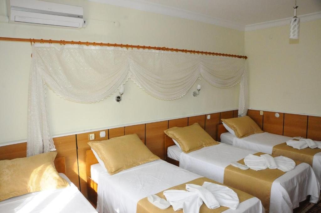 Четырехместный (Четырехместный номер) отеля Kervansaray Hotel, Памуккале