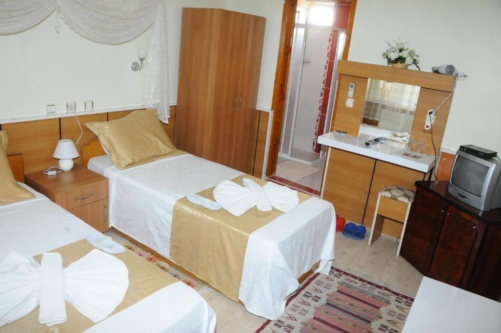 Двухместный (Стандартный двухместный номер с 2 отдельными кроватями) отеля Kervansaray Hotel, Памуккале