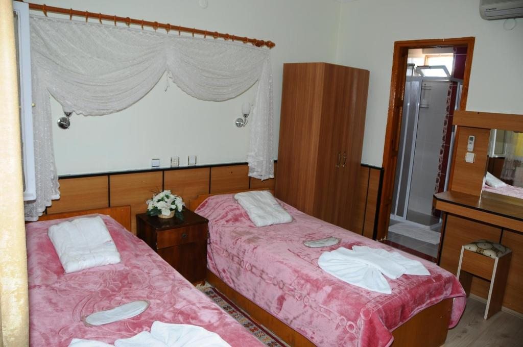 Двухместный (Двухместный номер Делюкс с 2 отдельными кроватями) отеля Kervansaray Hotel, Памуккале