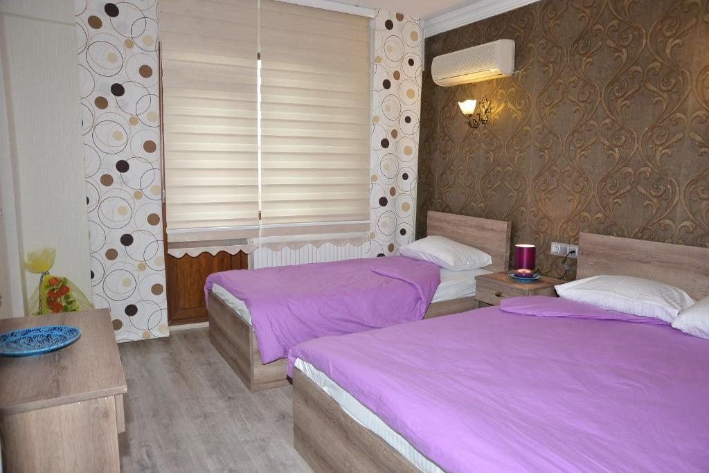 Двухместный (Стандартный двухместный номер с 1 кроватью или 2 отдельными кроватями и балконом) гостевого дома Ozbay Hotel, Памуккале
