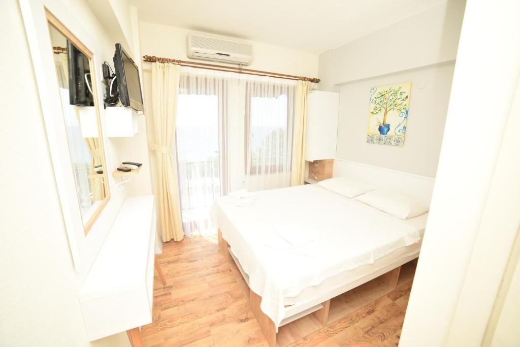 Двухместный (Двухместный номер с 1 кроватью или 2 отдельными кроватями, балконом и видом на море) отеля Limonata Hotel Assos, Ассос