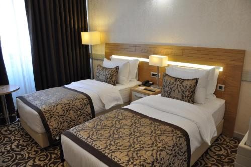 Двухместный (Стандартный двухместный номер с 2 отдельными кроватями) отеля Grand İtimat, Денизли
