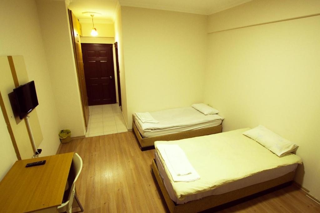 Двухместный (Стандартный двухместный номер с 2 отдельными кроватями) отеля Korkmaz Rezidans, Кайсери