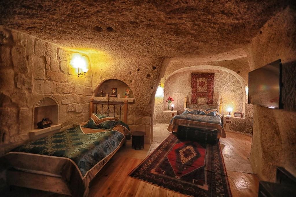 Трехместный (Трехместный номер Делюкс) отеля Traveller's Cave Hotel, Гереме