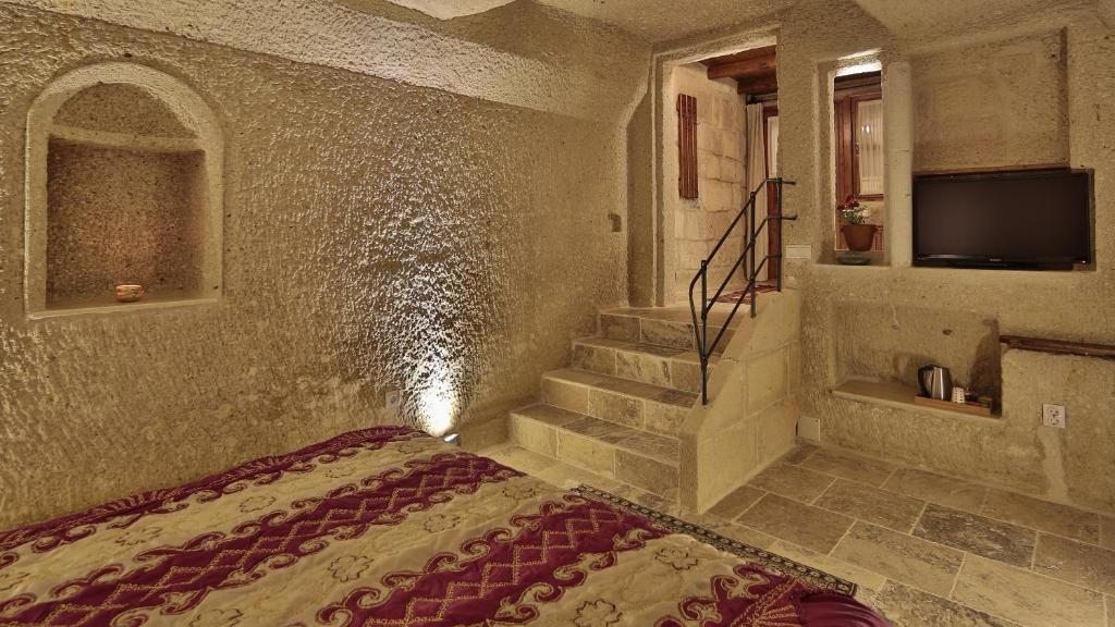Трехместный (Номер Делюкс «Пещера») отеля Osmanbey Cave House, Гереме