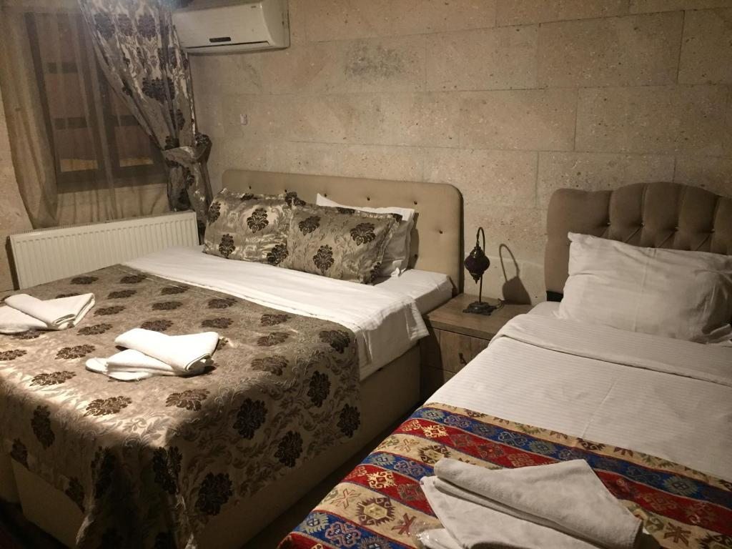 Четырехместный (Четырехместный номер с собственной ванной комнатой) отеля Diamond of Cappadocia, Гереме