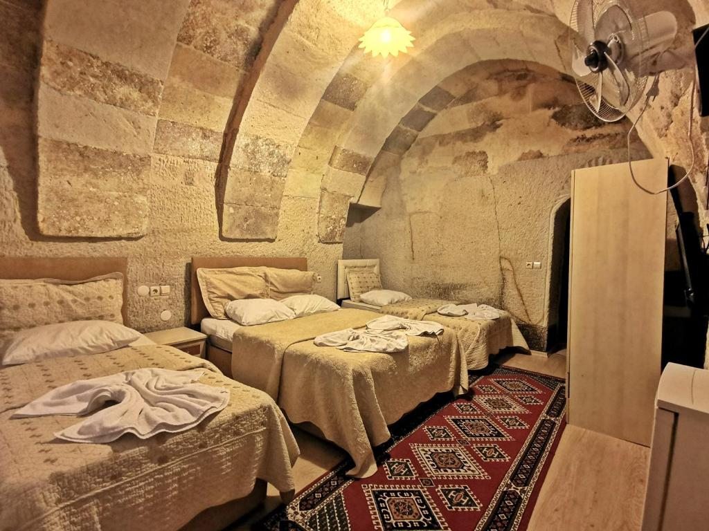 Сьюит (Люкс (для 4 взрослых)) отеля Falcon Cave Suites, Гереме