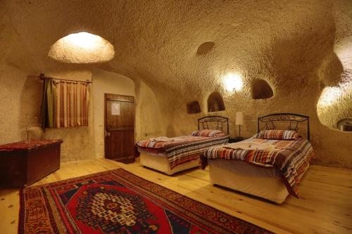 Трехместный (Трехместный номер в пещере) гостевого дома Karadut Cave Hotel, Гереме