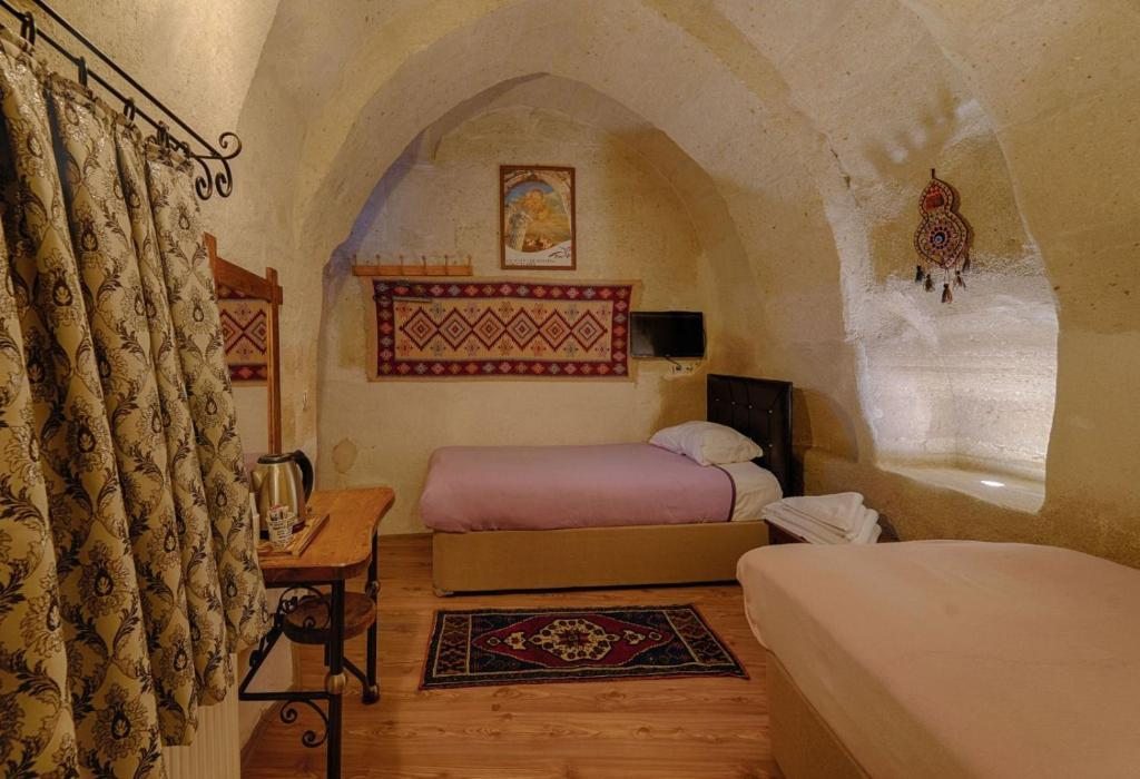 Двухместный (Двухместный номер «Стоун» с 2 отдельными кроватями) семейного отеля Kemer Cave House, Гереме