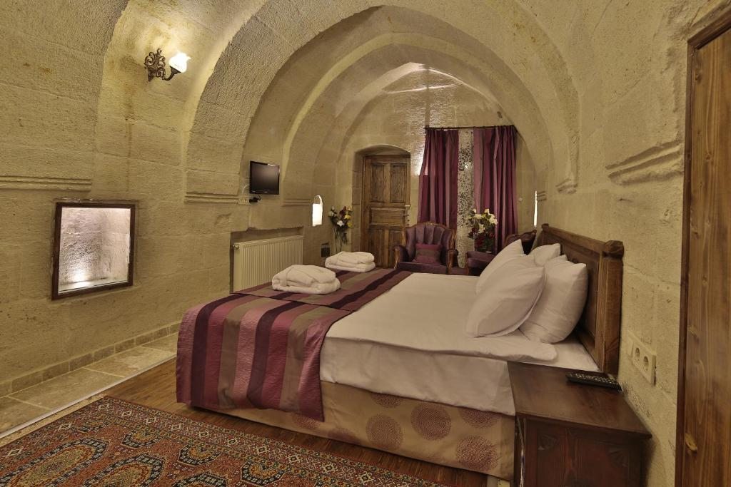 Двухместный (Двухместный номер Делюкс с 1 кроватью и сводчатым потолком) отеля Roc Of Cappadocia, Гереме