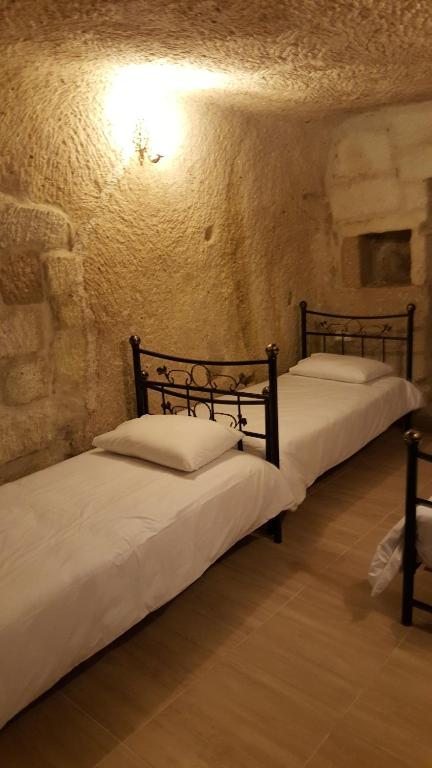 Номер (Односпальная кровать в общем номере «Пещера» для женщин) отеля Whisper Cave House, Гереме