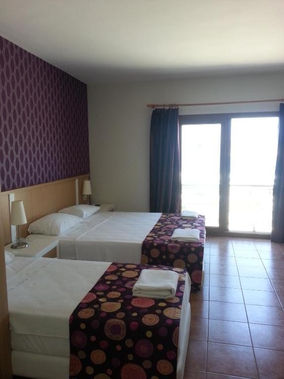 Трехместный (Трехместный номер с видом на море) отеля Riva Bodrum Resort- Adult Only +16, Гюмбет