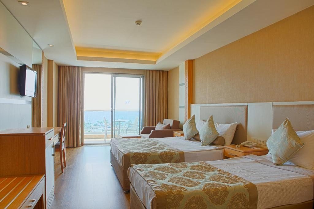 Двухместный (Стандартный двухместный номер с 1 кроватью или 2 отдельными кроватями) курортного отеля Kahya Resort Aqua & Spa, Авсаллар