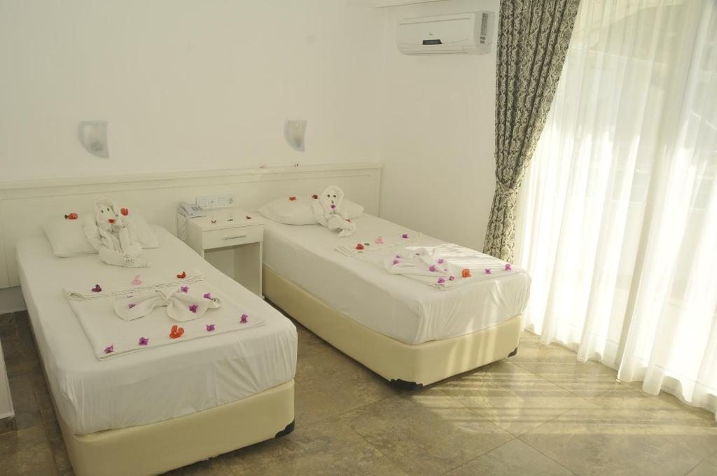Двухместный (Стандартный двухместный номер с 1 кроватью или 2 отдельными кроватями) отеля Bariscan, Махмутлар