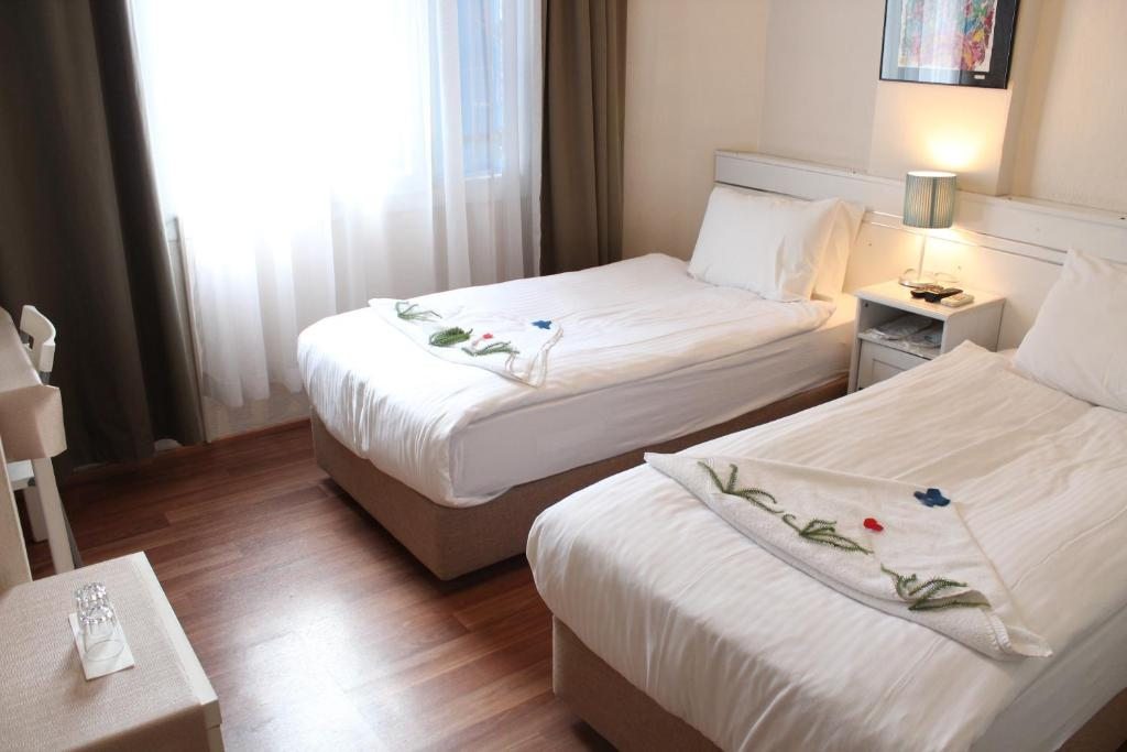 Двухместный (Двухместный номер с 2 отдельными кроватями) отеля Urkmez Hotel, Сельчук