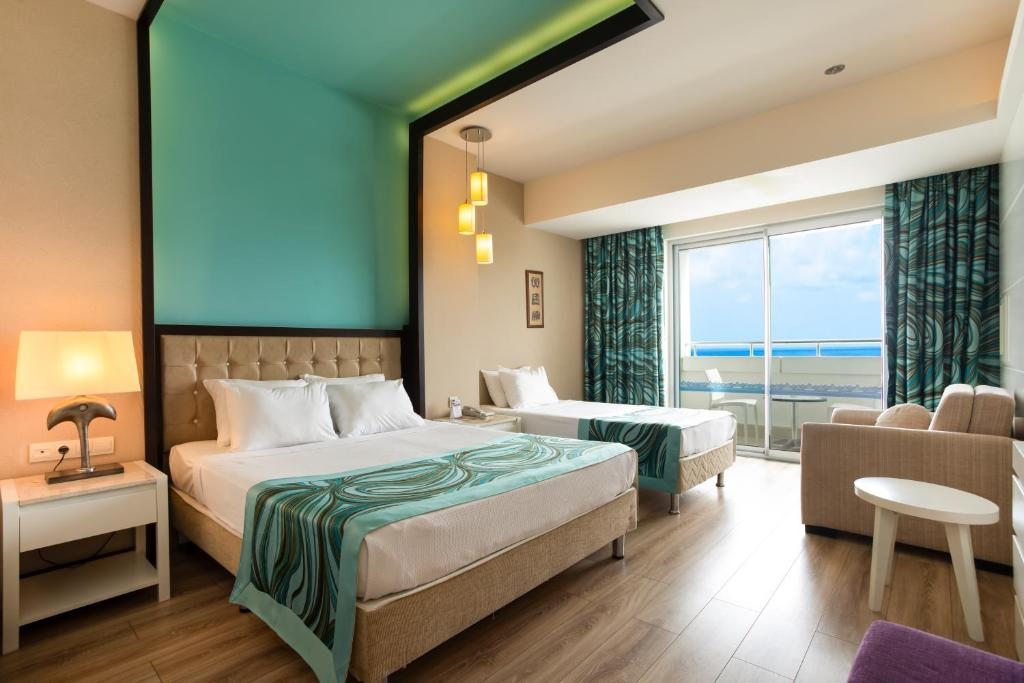 Двухместный (Стандартный двухместный номер с 1 кроватью или 2 отдельными кроватями, вид на море - В стоимость включены безалкогольные напитки) курортного отеля Orange County, Окурджалар