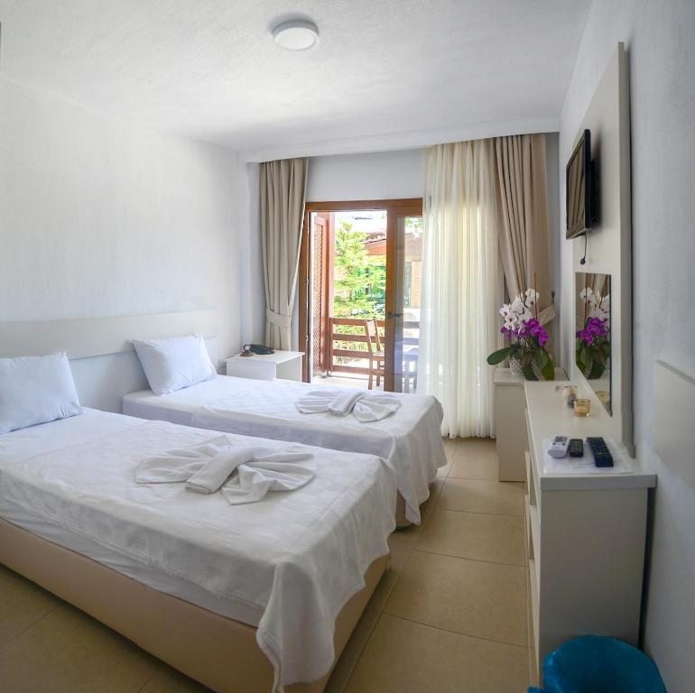 Двухместный (Стандартный двухместный номер с 1 кроватью или 2 отдельными кроватями и балконом) отеля Selvi Beach, Гельтюрбюку