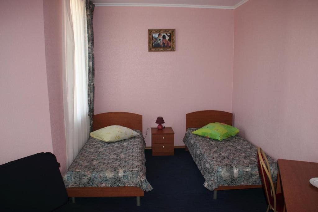 Двухместный (Двухместный номер с 2 отдельными кроватями и ванной комнатой) отеля Сокол-НК, Прокопьевск