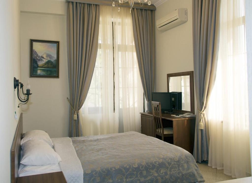 Двухместный (Улучшенный двухместный номер с 2 отдельными кроватями и видом на море) курортного отеля Райда, Гагра