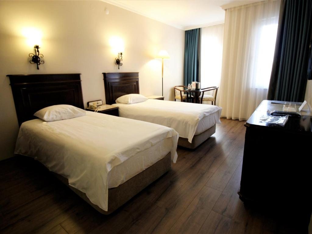 Двухместный (Стандартный двухместный номер с 1 кроватью или 2 отдельными кроватями) отеля Montania Town Hotel Mudanya, Муданья