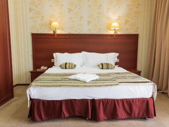 Фотография номера гостиницы Гранд Отель и СПА Майкоп