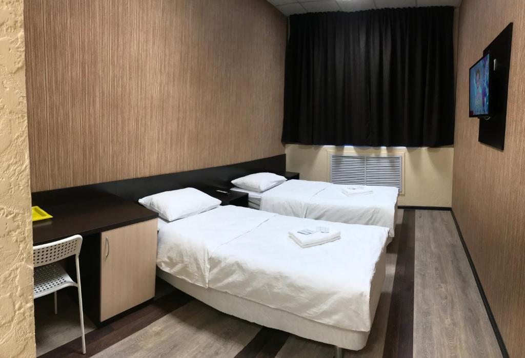 Двухместный (Улучшенный двухместный номер с 2 отдельными кроватями) отеля Мурманск Дискавери - Компас, Североморск