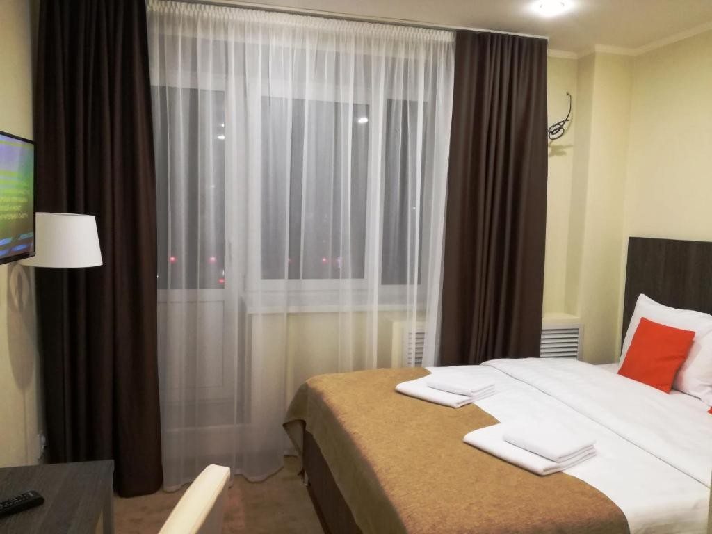 Двухместный (Двухместный номер с 1 кроватью или 2 отдельными кроватями и балконом) отеля MINOTEL, Владимир