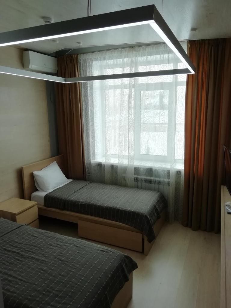 Двухместный (Двухместный номер с 2 отдельными кроватями и ванной комнатой) мини-отеля Дом, Саратов