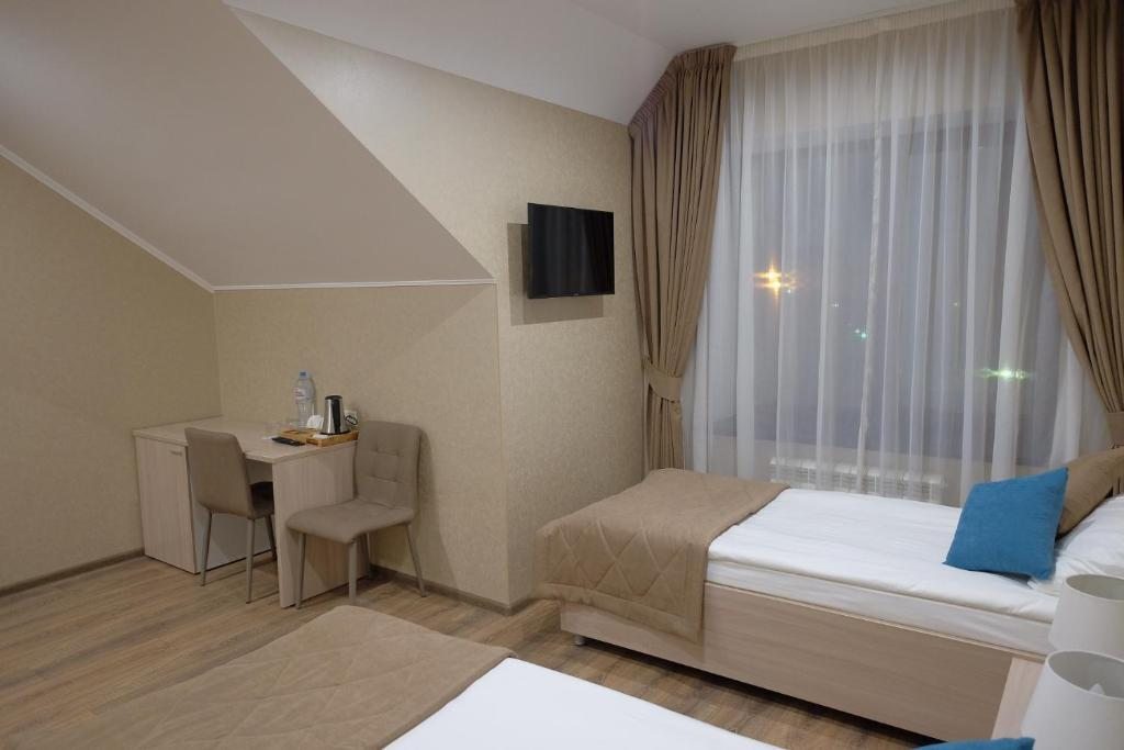 Двухместный (Двухместный номер Делюкс с 1 кроватью или 2 отдельными кроватями) отеля Зебра, Смоленск