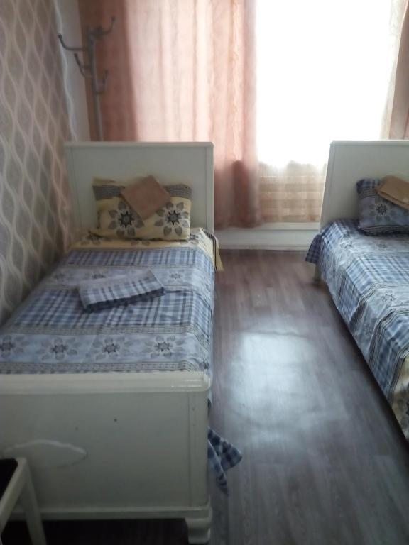 Двухместный (Бюджетный двухместный номер с 2 отдельными кроватями) хостела На Кирпильской 39а, Тимашевск